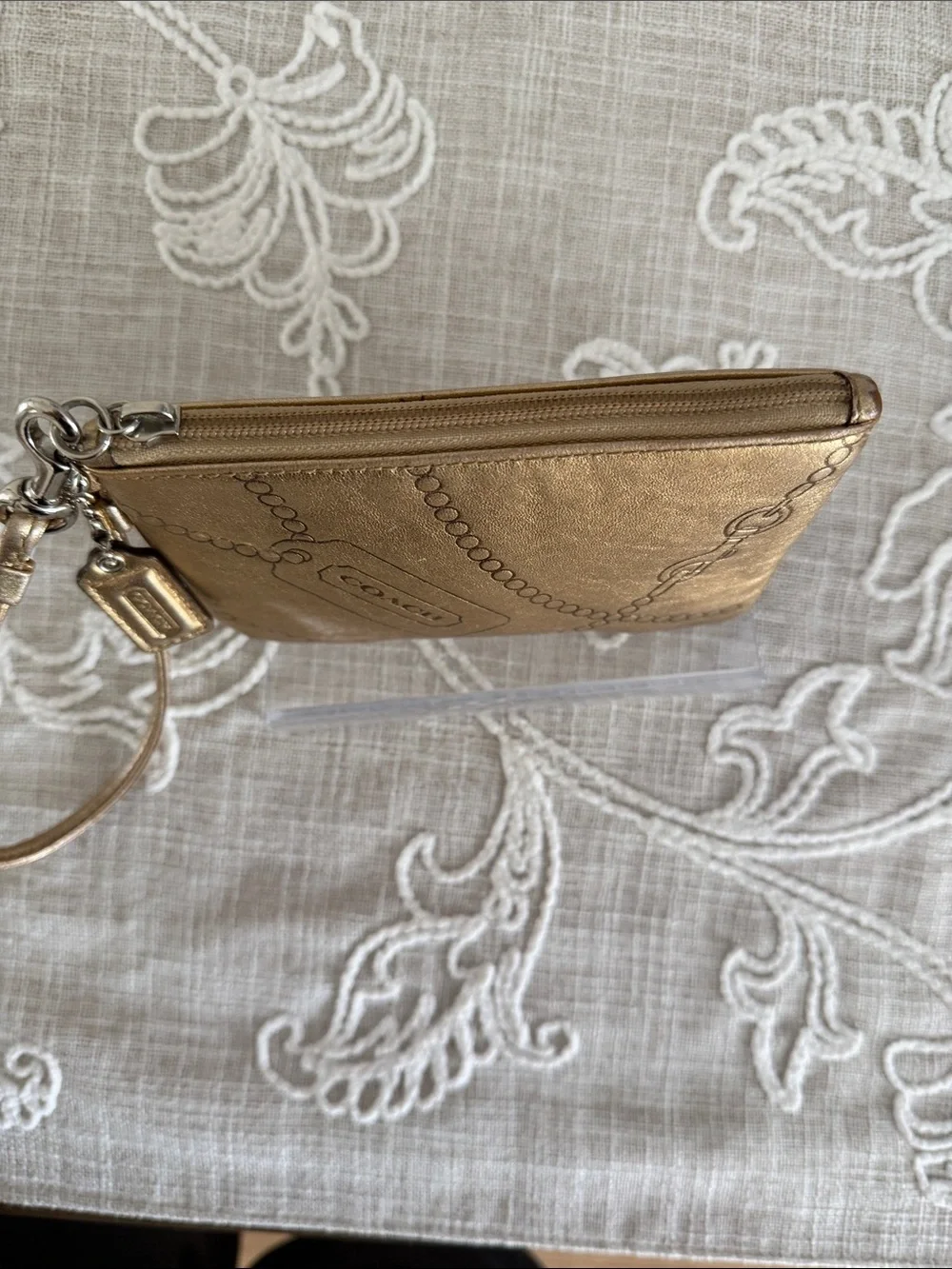 Coach Metallic Gold Wristlet with Embossed Chain Motif